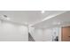 Finished basement with stairway, recessed lights, and bathroom access at 11569 W 27Th Ave, Lakewood, CO 80215
