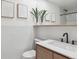 Stylish bathroom featuring modern fixtures, sleek vanity, and white tile backsplash at 11569 W 27Th Ave, Lakewood, CO 80215