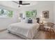 Bright bedroom featuring neutral colors, plush bedding, and natural light at 11569 W 27Th Ave, Lakewood, CO 80215