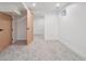 Spacious, carpeted bedroom with natural wood doors offers versatility and comfort at 11569 W 27Th Ave, Lakewood, CO 80215
