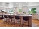 Modern kitchen with a large island, stainless steel appliances, and ample counter space at 11569 W 27Th Ave, Lakewood, CO 80215
