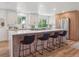 Modern kitchen with large island, lots of counter space, stainless steel appliances, and wood cabinets at 11569 W 27Th Ave, Lakewood, CO 80215