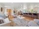 Bright, open living space flows to dining and kitchen, enhanced by stylish furnishings and hardwood floors at 11569 W 27Th Ave, Lakewood, CO 80215