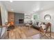 Inviting living room with a fireplace, hardwood floors, and stylish furniture arrangement at 11569 W 27Th Ave, Lakewood, CO 80215