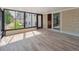 Charming sunroom featuring tile floors, brick accents, and an abundance of natural light at 11569 W 27Th Ave, Lakewood, CO 80215