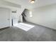 Spacious, carpeted living room with stairs to the next level, lots of sunlight, and a storage area at 17908 E 54Th Ave, Denver, CO 80249