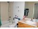Bathroom with tiled shower and bathtub, vanity, and sink at 7824 S Zante Ct, Aurora, CO 80016