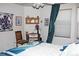 Comfortable bedroom with floral decorations, vintage desk and lots of natural light at 7824 S Zante Ct, Aurora, CO 80016