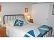 Comfortable bedroom with cozy quilt bedding and a view of the closet at 7824 S Zante Ct, Aurora, CO 80016