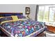 Bedroom featuring a bed with decorative pillows, bright, natural light, and attractive decor at 7824 S Zante Ct, Aurora, CO 80016