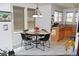 Cozy dining area with a stylish table, chairs, and bright, natural light at 7824 S Zante Ct, Aurora, CO 80016