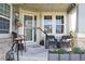 Inviting front porch with comfortable seating, decorative accents, and a cozy atmosphere perfect for relaxing at 7824 S Zante Ct, Aurora, CO 80016