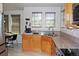Bright kitchen offers natural light, granite countertops, stainless steel appliances, and stylish flooring at 7824 S Zante Ct, Aurora, CO 80016