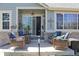 Inviting outdoor patio with charming decor, string lights, and comfortable wicker seating at 7824 S Zante Ct, Aurora, CO 80016