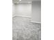 An open basement space featuring new carpet and neutral color walls and trim at 5677 S Lowell Blvd, Littleton, CO 80123
