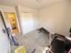 Bedroom with neutral walls, neutral carpet, and a closet at 5677 S Lowell Blvd, Littleton, CO 80123