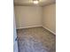 A view of a neutral color bedroom with new carpet, and lighting at 5677 S Lowell Blvd, Littleton, CO 80123