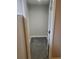 A view into a small walk-in closet with neutral color walls and new carpet at 5677 S Lowell Blvd, Littleton, CO 80123