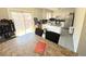 Eat-in kitchen area featuring an island, stainless steel appliances and sliding door to a patio at 5677 S Lowell Blvd, Littleton, CO 80123