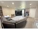 Cozy living room featuring a fireplace, neutral carpet, and a comfortable seating area at 5677 S Lowell Blvd, Littleton, CO 80123