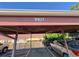 Covered parking area with numbered spots and lush greenery at 5677 S Lowell Blvd, Littleton, CO 80123