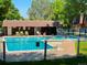 Community pool with lounge chairs and a nearby bathhouse at 5677 S Lowell Blvd, Littleton, CO 80123