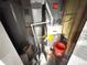 Utility room with a Gibson furnace and various supplies at 5677 S Lowell Blvd, Littleton, CO 80123