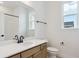 Bright bathroom featuring a double vanity with a white countertop and modern fixtures at 8376 Cokedale Dr, Littleton, CO 80125