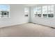 Bright bedroom featuring three windows to welcome natural light and showcase exterior views at 8376 Cokedale Dr, Littleton, CO 80125