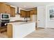 Modern kitchen with stainless steel appliances, island with bar seating, and plenty of storage at 8376 Cokedale Dr, Littleton, CO 80125
