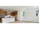 Open-concept kitchen featuring stainless steel appliances, an island, and ample cabinet space at 8376 Cokedale Dr, Littleton, CO 80125
