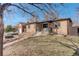 Lovely home with solar panels, a covered porch, and a well-manicured front lawn at 2045 Jamaica St, Aurora, CO 80010