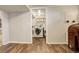 Convenient laundry room located off the basement with side-by-side washer and dryer at 2045 Jamaica St, Aurora, CO 80010