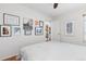 Bedroom with hardwood floors and gallery wall at 7113 Depew Ct, Arvada, CO 80003