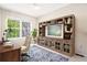 A home office featuring a wooden desk, an ornate chair and large storage at 1566 S Syracuse St, Denver, CO 80231