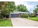 Ranch-style home with attached garage and landscaping at 3711 S Uinta St, Denver, CO 80237