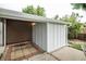 Brick patio next to a storage shed and house exterior at 3711 S Uinta St, Denver, CO 80237