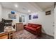 Finished basement rec room with a comfortable sofa and a window for natural light at 2428 Concord Cir, Lafayette, CO 80026