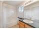 Bathroom featuring a shower-tub combination and mirrored vanity at 2428 Concord Cir, Lafayette, CO 80026