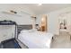 A bright bedroom features a bed and an archway to an ensuite bathroom for privacy at 2428 Concord Cir, Lafayette, CO 80026