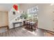 Bright and airy dining room with large windows, hardwood floors, and modern decor at 2428 Concord Cir, Lafayette, CO 80026