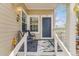 Inviting front porch with outdoor seating, a view of the front yard, and attractive curb appeal at 2428 Concord Cir, Lafayette, CO 80026