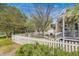 Charming front yard with white picket fence, garden, and walkway leading to the home's entrance at 2428 Concord Cir, Lafayette, CO 80026