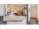 Well-lit kitchen features stainless steel appliances, light wood cabinets, and laminate countertops at 2428 Concord Cir, Lafayette, CO 80026