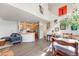 Open-concept living area with modern kitchen, dining area, and staircase to the upper level at 2428 Concord Cir, Lafayette, CO 80026