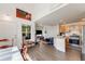 Open-concept living room with a kitchen, a large window, and lots of natural light at 2428 Concord Cir, Lafayette, CO 80026