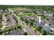 Aerial view of a neighborhood with well-manicured lawns, parks, and tree-lined streets at 5451 W 73Rd Ave, Westminster, CO 80003