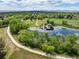 Overhead view of a pond surrounded by walking trails and green space in neighborhood at 5451 W 73Rd Ave, Westminster, CO 80003