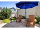 Comfortable patio featuring an umbrella and Adirondack chairs for a relaxing outdoor space at 5451 W 73Rd Ave, Westminster, CO 80003
