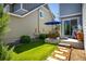 Charming back patio with seating area and stepping stones, ideal for outdoor gatherings at 5451 W 73Rd Ave, Westminster, CO 80003